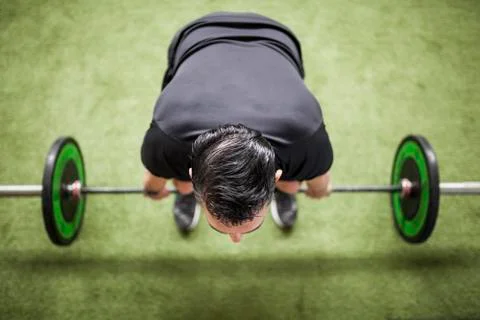 Man training on artificial grass Foto stock
