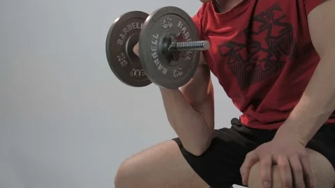 Man training biceps with barbells Stock Footage 69847538