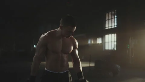 Man training biceps with dumbbells Stock Footage 236179494