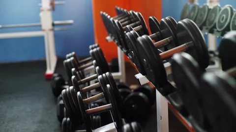 Man training with dumbbells Stock Footage 62447246