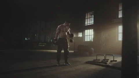 Man training with dumbbells Stock Footage 236179381