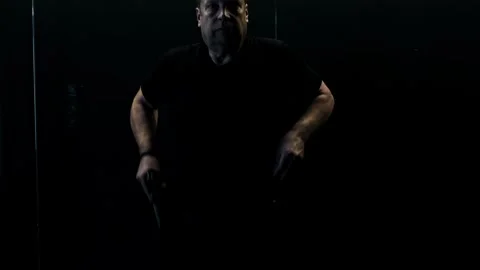 Man Training Dynamic Shooting with Handgun Stock Footage 245984363