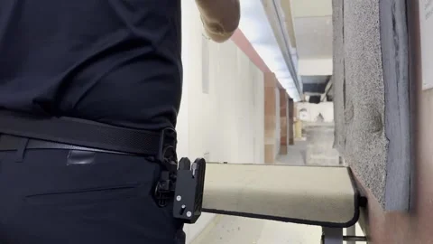 Man Training Dynamic Shooting with His Handgun and Holster Stock Footage 265218501