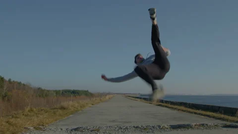 Man Is Training Flip Jumps Stock Footage 166349546
