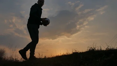 Man is training freestyle bal Hacky On Sunset Sack silhouette freestyle concept Stock Footage 103739880