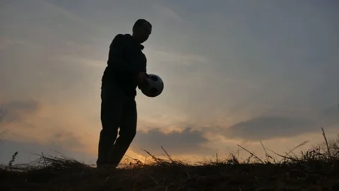 Man is training freestyle bal Hacky On Sunset lifestyle Sack silhouette Stock Footage 103740224
