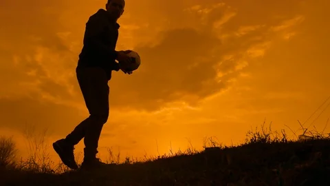 Man is training freestyle bal Hacky On Sunset Sack silhouette freestyle concept Stock Footage 105325784