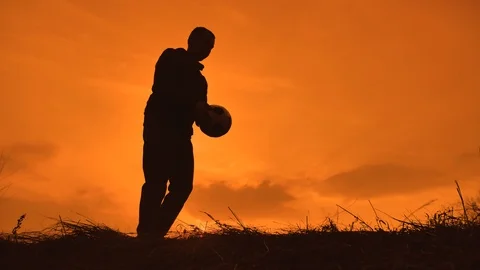 Man is training freestyle bal Hacky On Sunset Sack lifestyle silhouette Stock Footage 105326038