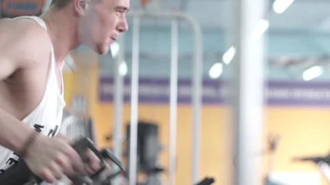 Man is training in gym Stock Footage 90492638
