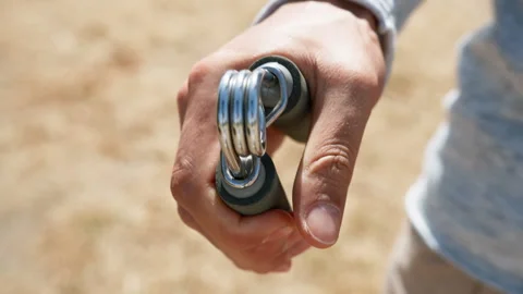 Man Training His Arm With An Hand Grip Stock Footage 276808354