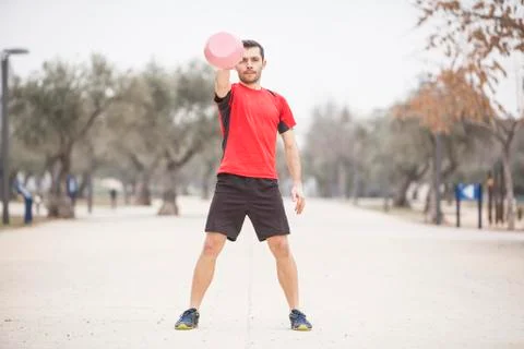 Man training with the kettle bell front position Stock Photos