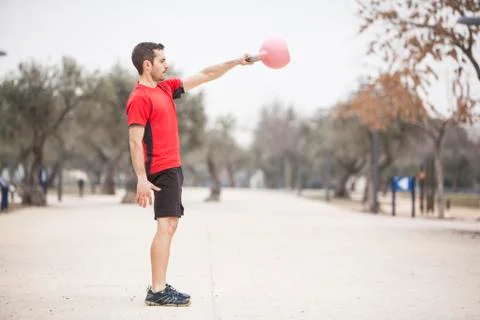 Man training with the kettle bell side position Stock Photos