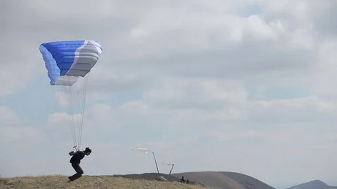 Man training with paraglider Stock Footage 72773731