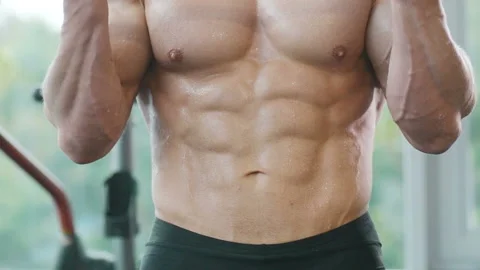 Man training pumping up biceps muscles Video stock 148353964