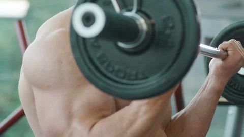 Man training pumping up biceps muscles Video stock 148354040