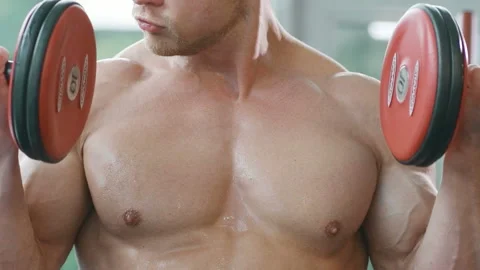 Man training pumping up biceps muscles Video stock 148354050