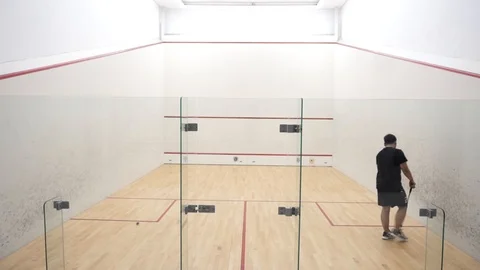 Man training in squash alone Stock Footage 121745156