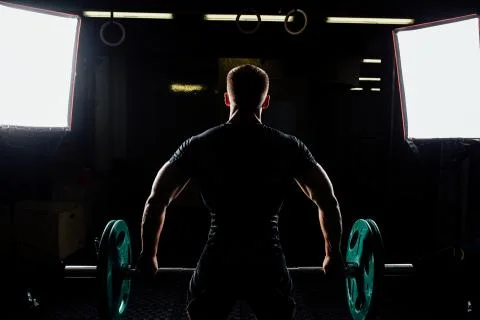 Man training squats with barbells over head Stock Photos