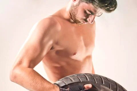 The Man is Training With Tire Stock Photos