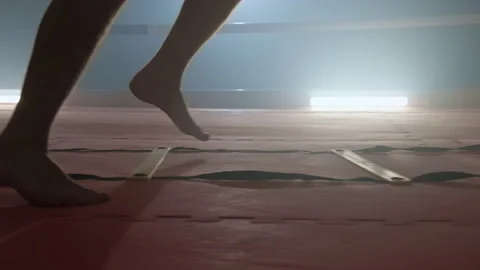 Man training while stepping. Boxer jumping on divided sections on floor. Stock Footage 166813112