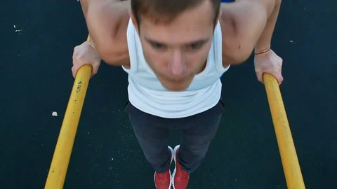 Man trains on the bars Stock Footage 98995468