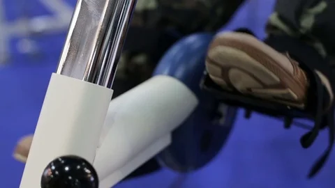 A man trains on a bicycle simulator Stock Footage 82338563