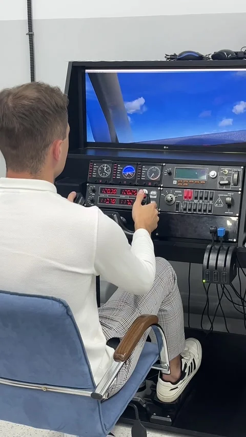 A man trains on a flight simulator of a passenger plane. Stock Footage 317750175