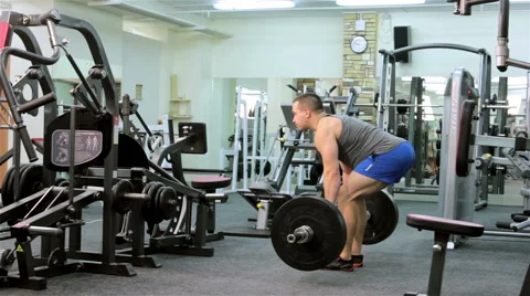 A man trains in a gym Stock Footage 47245552