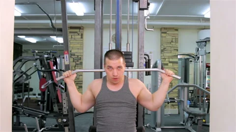 A man trains in a gym Stock Footage 47260403