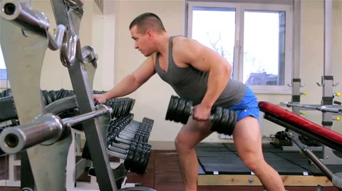 A man trains in a gym Stock Footage 47260515