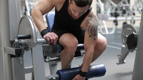 Man trains his feet on the simulator Stock Footage 62563623