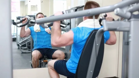 Man trains on machines Stock Footage 102227558