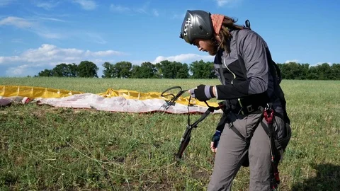 Man Trains Before Paragliding Stock Footage 77696199