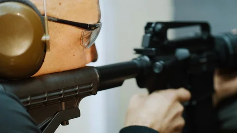 Man trains to shoot at the shooting range Stock Footage 120246911