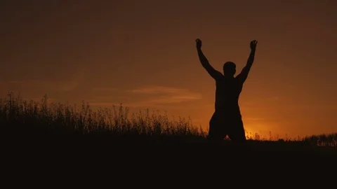 A man trains at sunset or sunrise Stockbeeldmateriaal 76152887