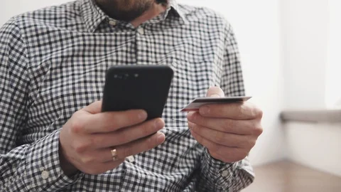 Man is transferring money online using app in smartphone and credit card Stock Footage 91019935