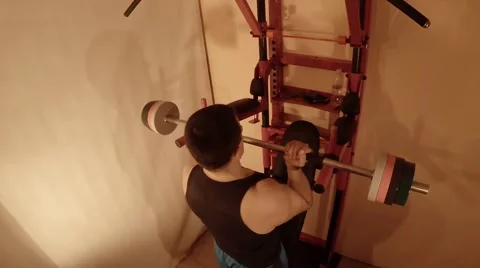 Man Transforms the Wall Bars in a Home Gym Stock Footage 62475829