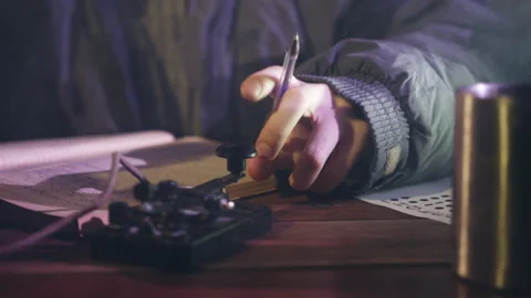 Man transmits information by telegraph sitting at table Stock Footage 229843156