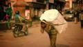 Man transports large load of freight, Kathmandu, Nepal HD Footage
