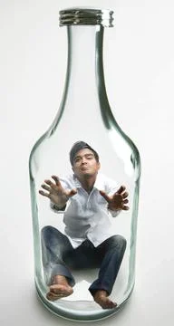 Man trapped inside of a bottle anti drinking concept Stock Illustration