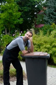 Man with trashcan Stock Photos