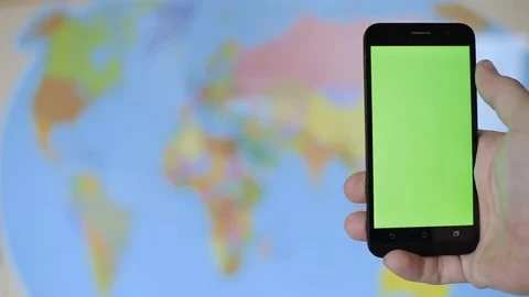Man traveler hands using smart phone with green screen close up. Chroma key Stock Footage