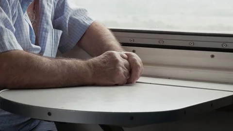 Man traveling by train, looking through the window. Georgia Stock Footage 82463497
