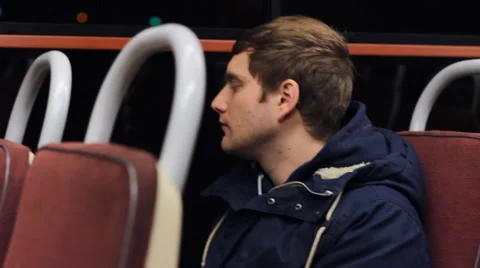 Man traveling by tram, looking through the window Video stock 56856953