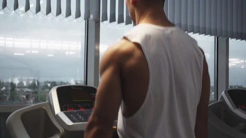Man on treadmill Stock Footage 117910631