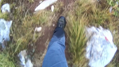 Man trekking on mountain trail Stock Footage 80501873
