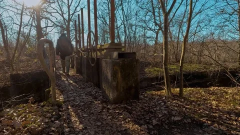Man trekking over a bridge Stock Footage 233212726