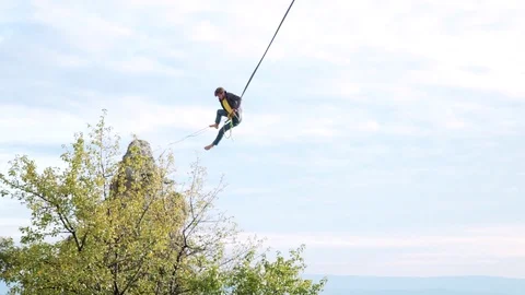 Man Tries Slacklining Over The Rock Stock Footage 120618537
