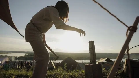 Man tries to split a firewood Stock Footage 82345815