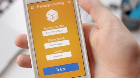 Man tries to track his package using smartphone application but the shipment is Stock Footage 77980547